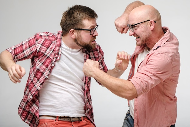 Two friends in glasses argued and had a fight