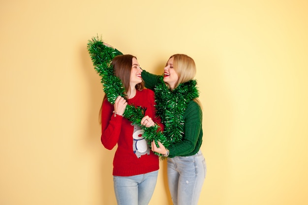 Two friends hipster girls playing and having fun