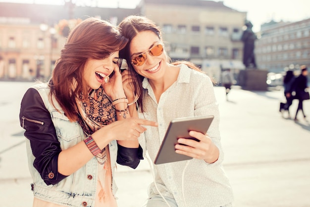 Two friends listening to music