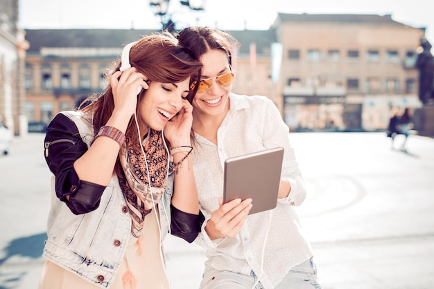 Two friends listening to music