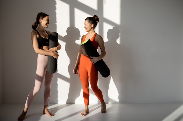 Two friends talk during the yoga break