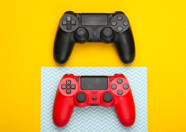 Two Gamepads on yellow blue.