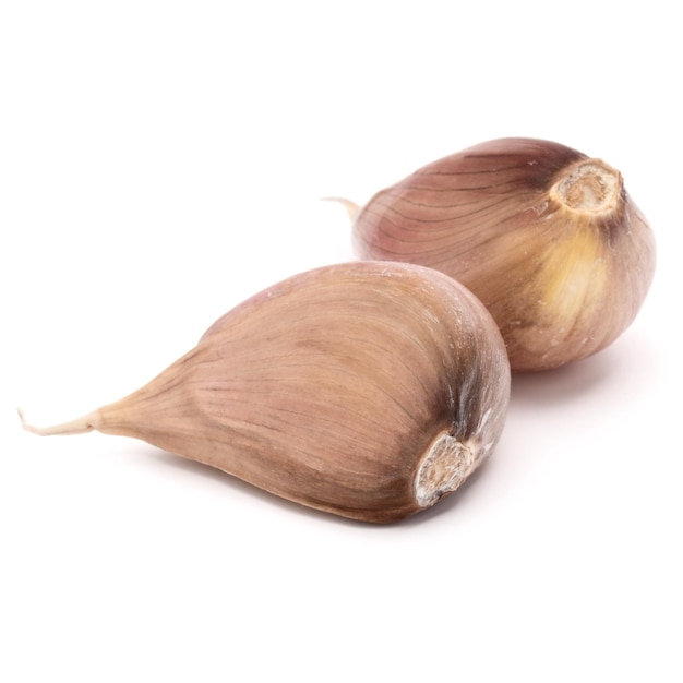 Two garlic cloves isolated on white background cutout