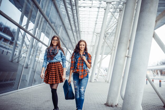 Two girl friends meeting in airoport.