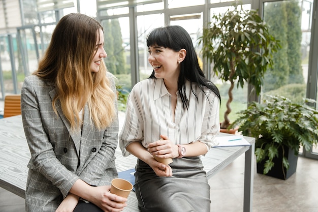 Two girls are laughing together