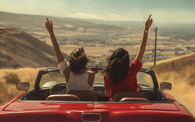 Two girls in a car with their hands up driving at summer