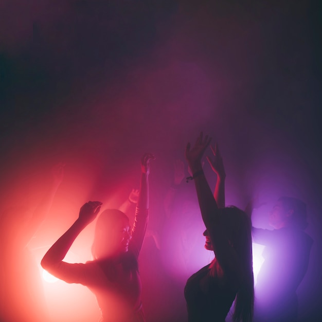 Two girls dancing in disco