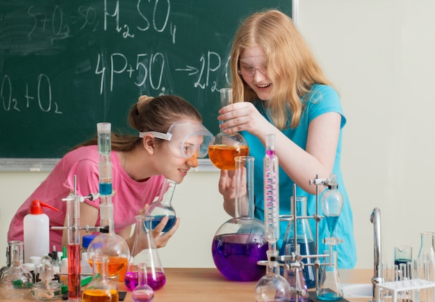 Two girls doing chemical experiments