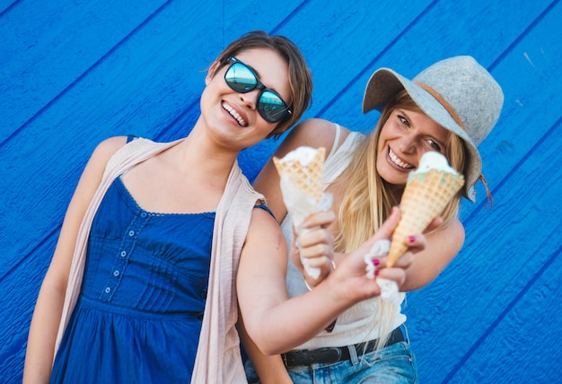 Two girls eating ice-cream