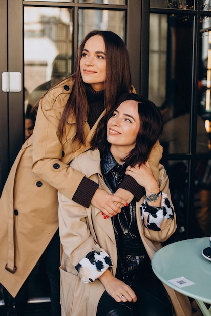 Two girls friends at the cafe together