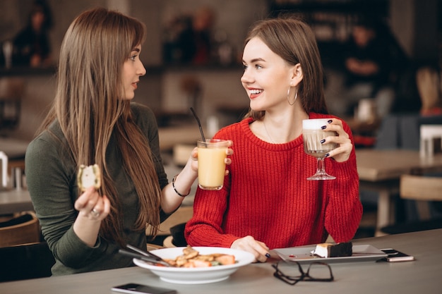 Two girls having lunch in a cafe