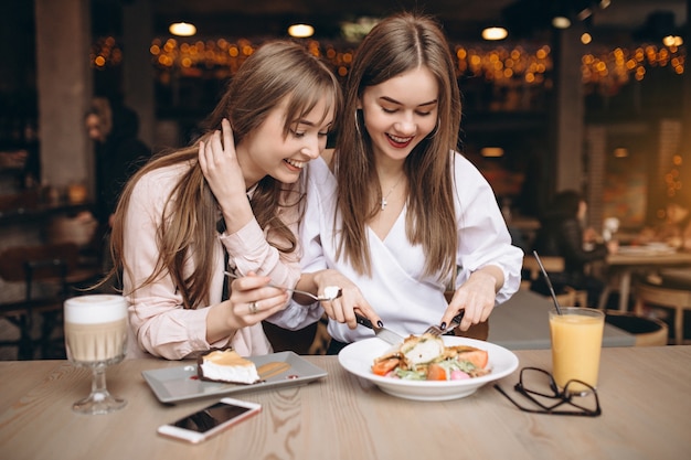 Two girls having lunch in a cafe