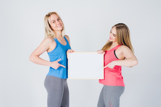 Two girls holding the frame