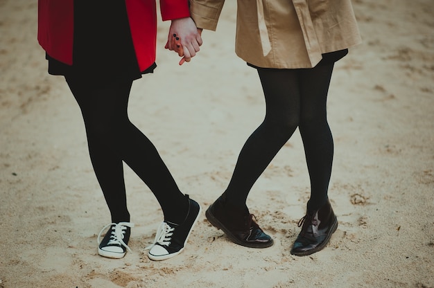 two girls holding hands