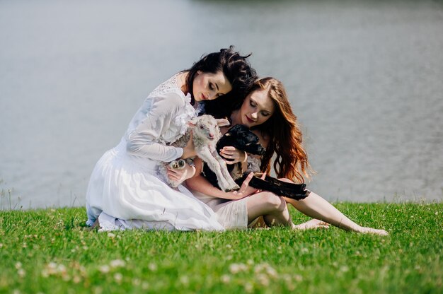 two girls on the lake