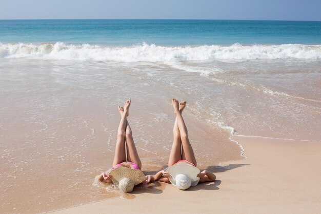 Two girls relaxing on the beach