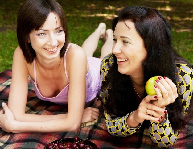 Two girls relaxing in park