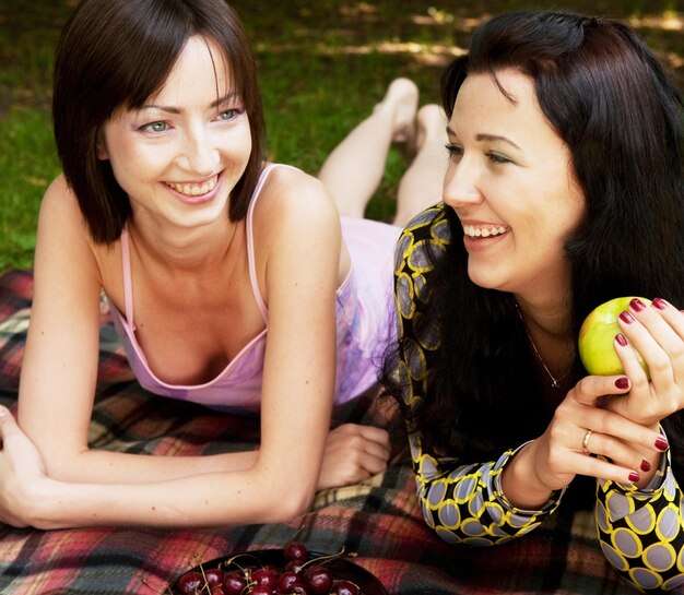 Two girls relaxing in park