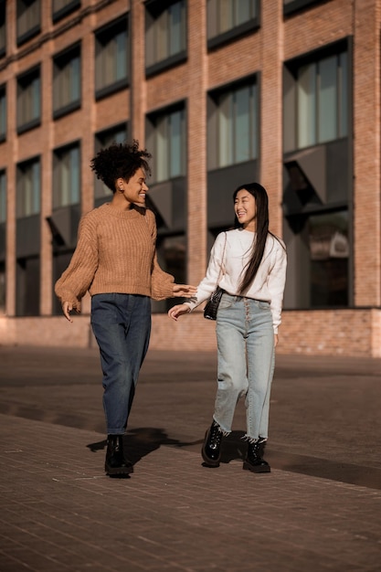 Two girls. Two cute girls walking together in the street