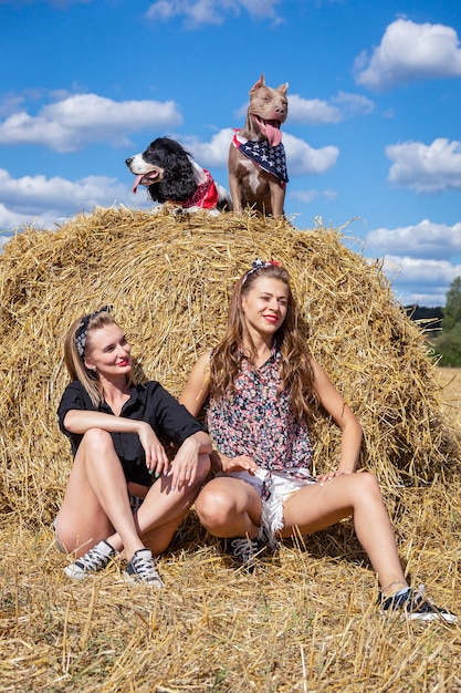 Two girls with dogs