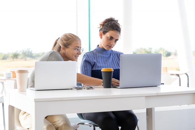 Two girls working together in a coworking