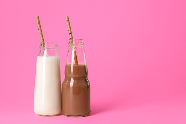 Two glass bottles of milk or milkshake