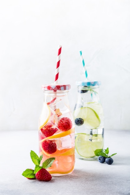 Two glass bottles with lemonade