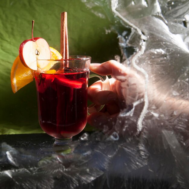 Two glass glasses of mulled wine on a winter background