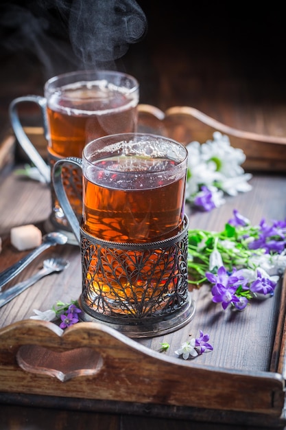 Two glass of green tea in filigrane handle