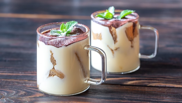 Two glass mugs of tiramisu