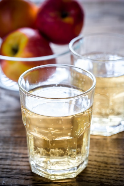 Two glasses of cider on the wooden table