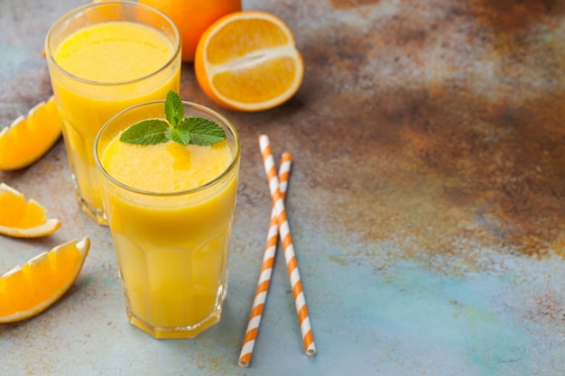 Two glasses of freshly squeezed orange juice.