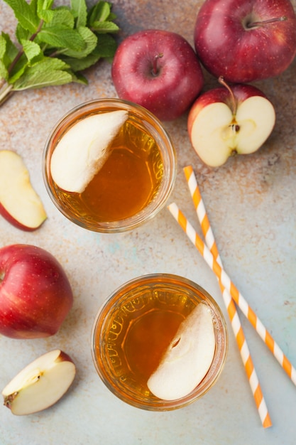 Two glasses of red Apple juice.