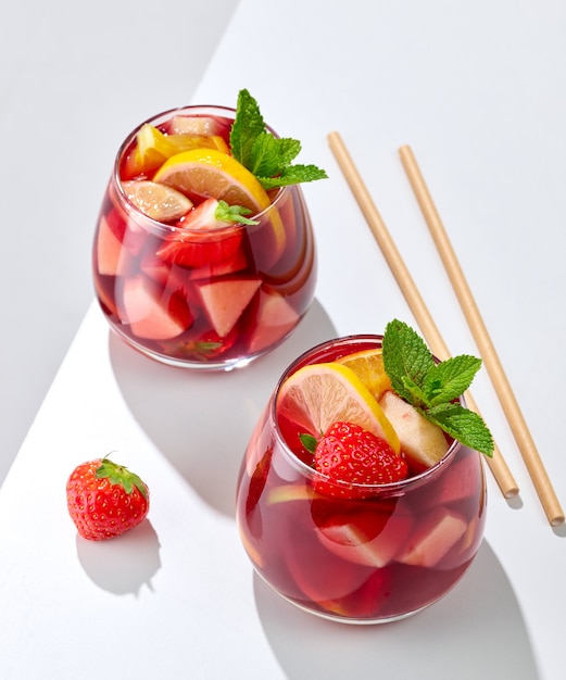 Two glasses of red sangria on white restaurant table