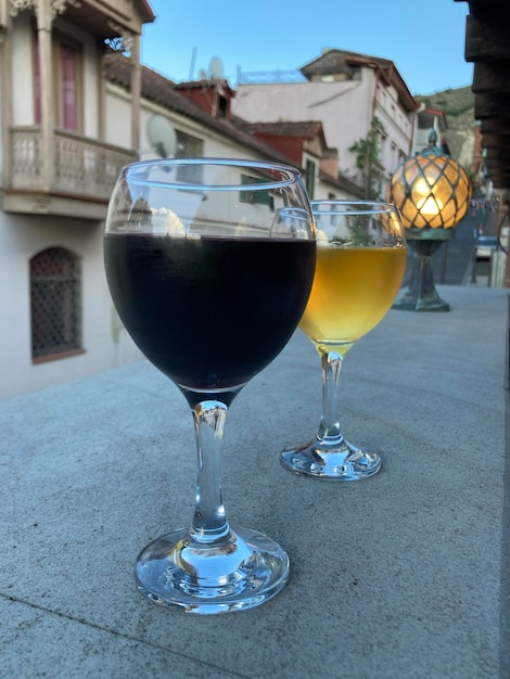 two glasses of red and white wine closeup