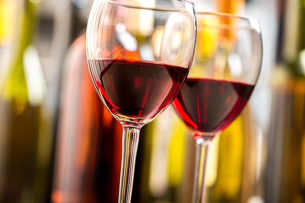 Two glasses of red wine on blurred background