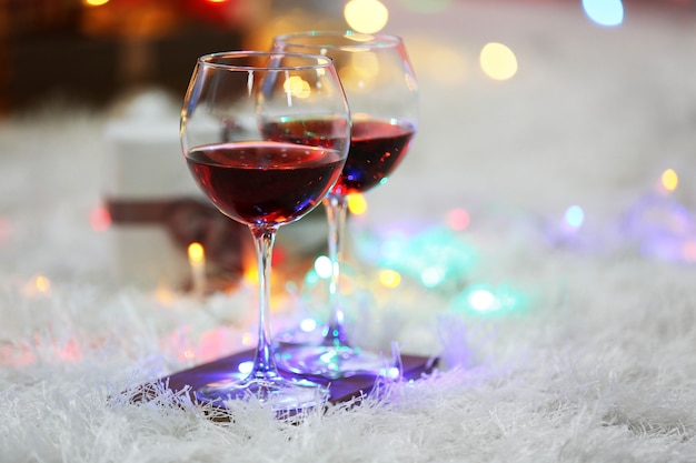 Two glasses of red wine on Christmas decoration