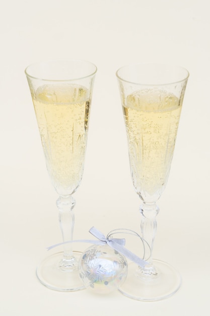 Two glasses with christmas champagne and bubbles