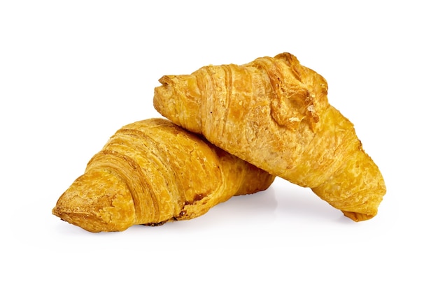 Foto due croissant dorati isolati