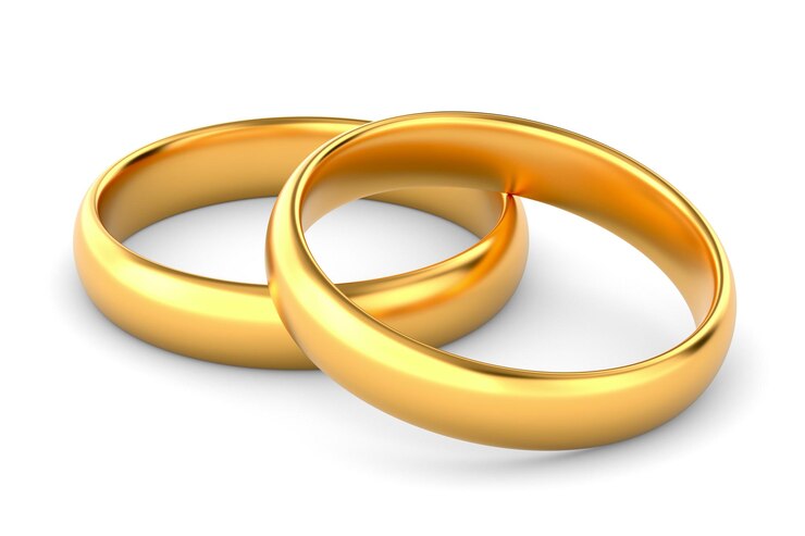 Photo two golden wedding rings on white background. isolated 3d illustration