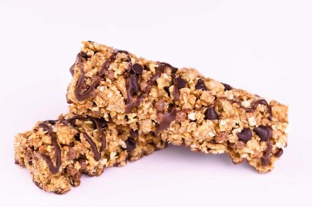 Two granola bars on a white background Closeup