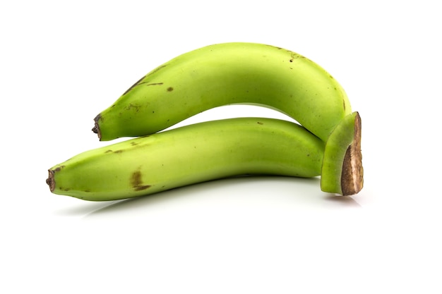 Photo two green banana isolated on white background