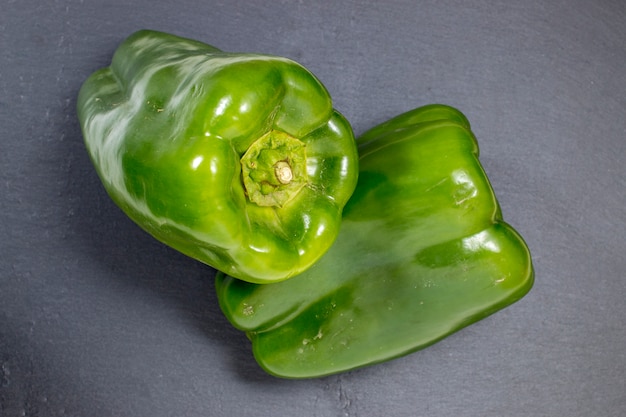 Two green bell peppers