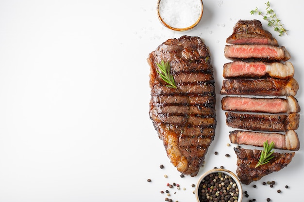 Two grilled marbled beef steaks striploin.