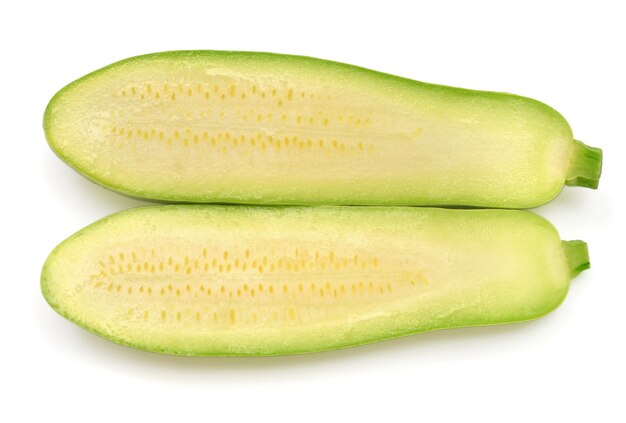 Two half fresh squash vegetable marrow zucchini isolated on white background Flat lay top view