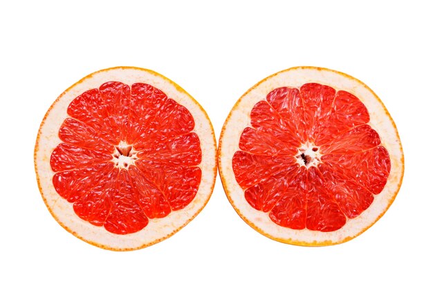 Two halves of pink grapefruit isolated on white background