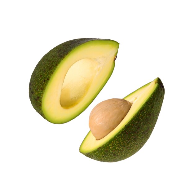 Two halves of ripe avocado isolated on white