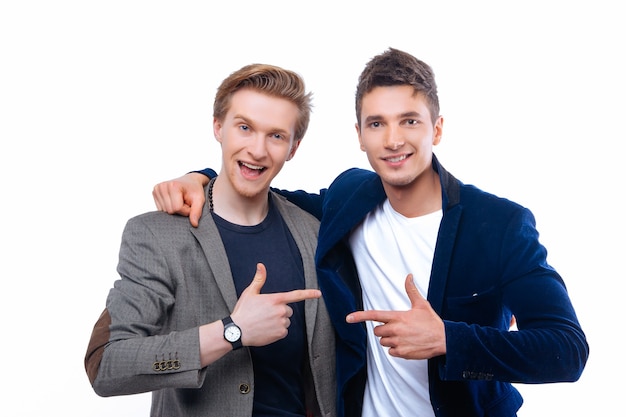 Two handsome young men isolated on white and smile