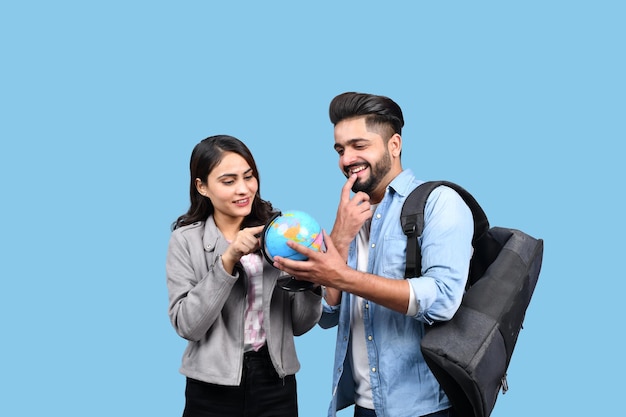 two happy casual students with back pack indian pakistani model