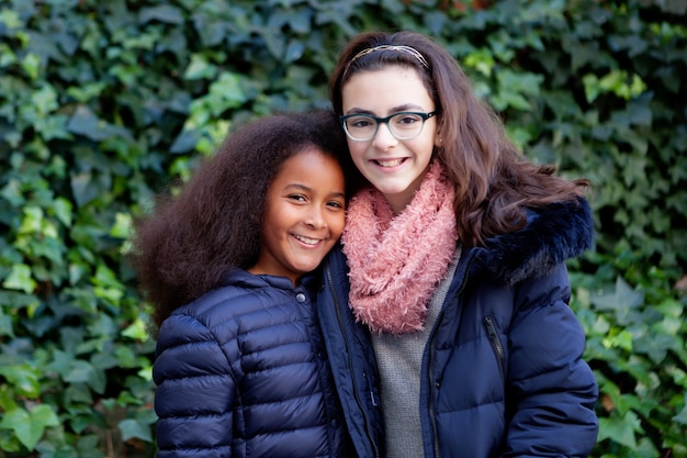 Two happy girls in the park 